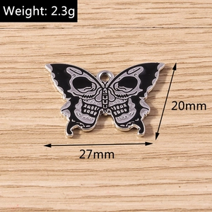 Detail view of gothic butterfly pendant with skull design and 27x20mm dimensions