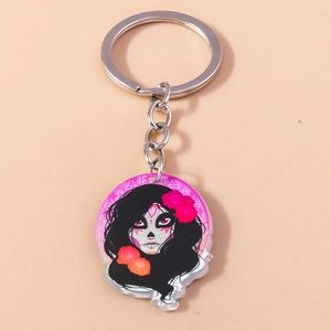 Detail view of Halloween keychain featuring acrylic Dia de los Muertos skull woman portrait
