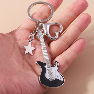 Cartoon electric guitar keychain with heart carabiner and star pendant in black and white