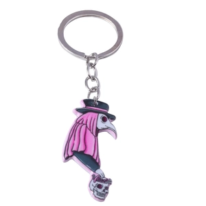 Plague doctor keychain featuring a pink robe and bird mask for Halloween decor