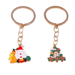 Christmas keychain set featuring Santa Claus and Christmas tree with golden rings