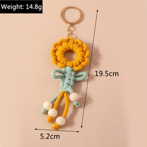 Detail showing dimensions of the handmade crochet sunflower keychain at 19.5cm length