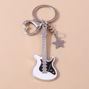 Detail of cartoon guitar keychain with heart clasp and star charm in black and white finish