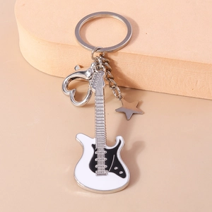 Detail view of electric guitar keychain with heart-shaped clip and star charm