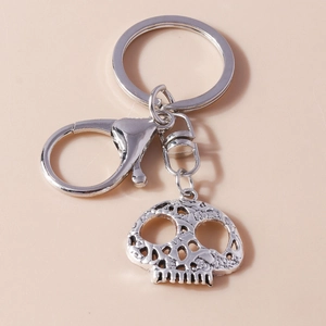 Silver alloy keychain featuring hollow skull pendant with lobster clasp and round ring