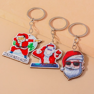 Three cool wooden Santa Claus keychains with sunglasses and DJ headphones for Christmas
