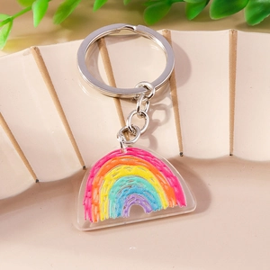 Portachiavi arcobaleno creativo in acrilico con motivi colorati su supporto beige
