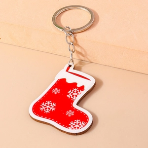 Christmas red sock keychain with white snowflake pattern and silver metal key ring