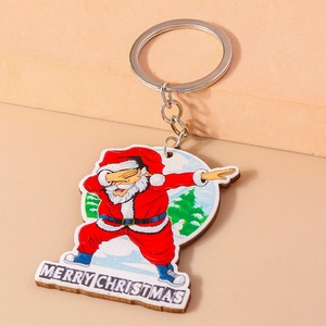 Detailed view of Santa Claus keychain with Dab pose and Merry Christmas text