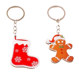 Cute gingerbread man and red Christmas sock keychain with festive snowflake pattern set