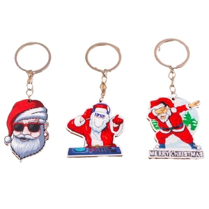 Cool skiing Santa Claus keychain set with acrylic cartoon designs for Christmas gifts