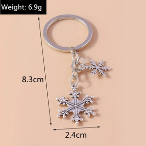 Silver snowflake keychain with dimensions and weight detail for Christmas gifts