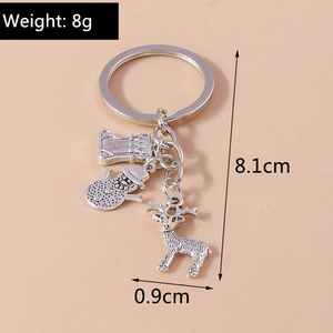 Detail of silver Christmas keychain with reindeer, snowman and stocking charms, weight 8g