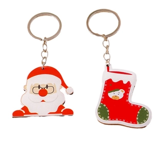 Lot de porte-clés de Noël avec tête de Père Noël et chaussette de Noël rouge décorative