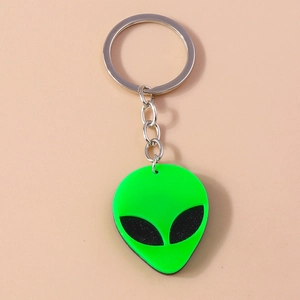 Detailed view of a bright green alien head keychain with a silver metal ring