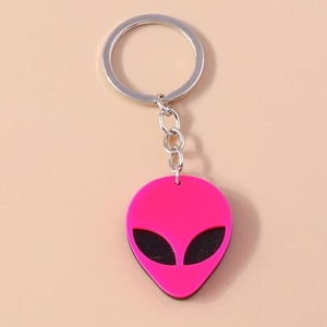 Punk style alien keychain with neon pink pendant and black eyes on silver ring