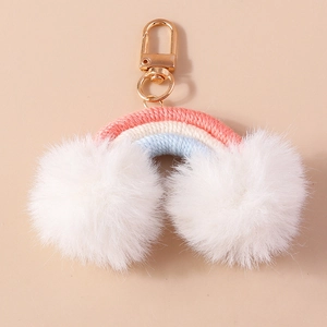 Cute handmade rainbow keychain with white plush pom clouds and a golden lobster clasp