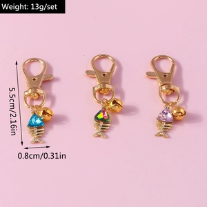 Set of 3 fish bone keychains in blue, rainbow, and pink with size and weight info