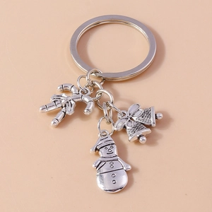 Silver alloy Christmas keychain featuring candy cane, bells, and snowman pendants