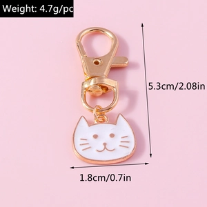 Detailed size specifications of the gold-plated cat pendant keychain showing height and width