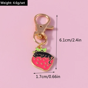 Close-up of strawberry cat keychain showing 6.1cm height and 1.7cm width dimensions