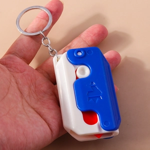 Mini carrot gravity knife keychain with retractable blade and portable ring detail