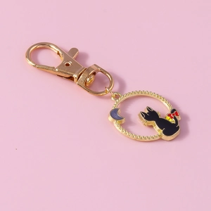 Porte-clés chat lune évidé avec fermoir doré et pendentif en émail noir pour femmes