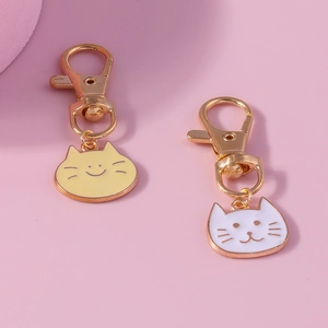 Cute cartoon cat enamel pendants with lobster clasps in yellow and white colors