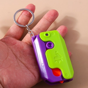 Detail of colorful foldable 3D plastic carrot knife keychain with purple and green finish