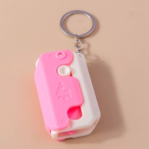 Cute pink and white mini gravity knife keychain tool with a metal keyring and chain
