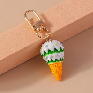 Detailed view of cute ice cream keychain with colorful sprinkles and golden metal lobster clasp