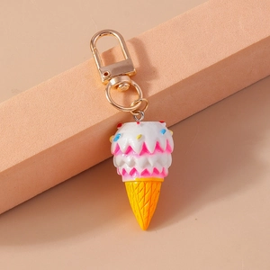 Detailed macro view of a 3-layer ice cream pendant with a golden lobster clasp