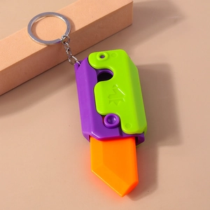 Detail of colorful gravity fidget toy keychain with smooth plastic finish and metal ring