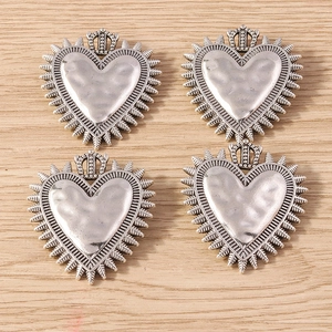 Set of 4 vintage silver alloy heart pendants with crown and radiant sunburst details