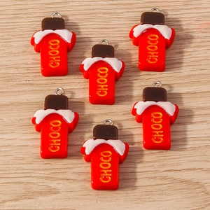 Pack of 6 red chocolate food play charms with Choco text and metal rings on wood