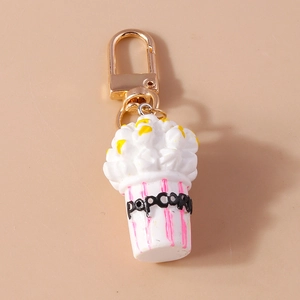 Creative popcorn keychain featuring pink striped paper cup and golden metal carabiner