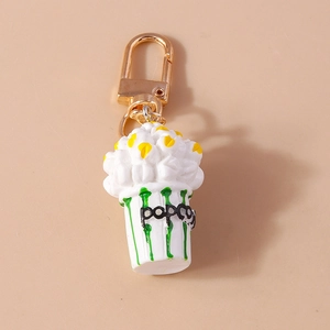 Top view of creative popcorn keychain with realistic textures and golden metal clasp