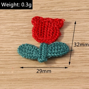 Handmade knitted red tulip flower accessory with green leaves, size 29mm x 32mm