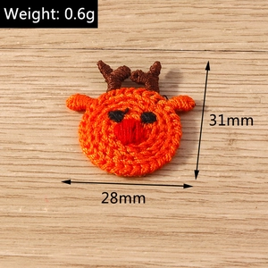 Macro detail of knit reindeer embroidery patch with dimensions 31mm by 28mm for DIY crafts