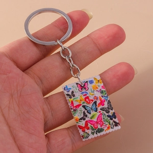 Detail of colorful butterfly oil painting pattern on rectangular acrylic keychain pendant