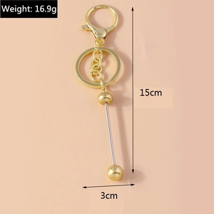 Polished gold alloy keychain featuring creative rotating beads with dimensions 15cm x 3cm
