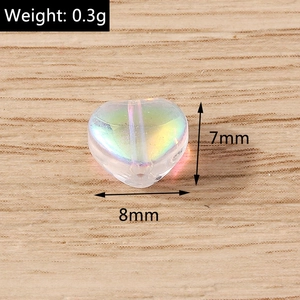 Macro detail of 8mm heart-shaped iridescent translucent bead for DIY jewelry making