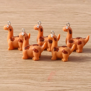 Set of five cute orange dinosaur charms with brown spots and silver hanging rings