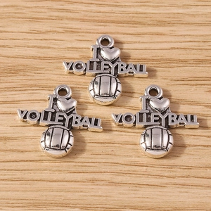 Detail of silver alloy I Love Volleyball sports pendants with 3D ball design on wood