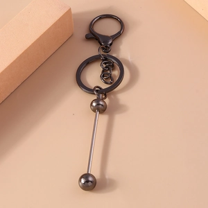 Detail view of gunmetal alloy keychain with swivel lobster clasp and bead pendant