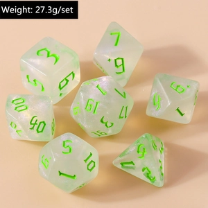 Macro detail of 7-piece transparent green glitter polyhedral dice set with gothic numbers