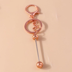 Minimalist geometric rose gold metal keychain with lobster clasp and round ball pendant