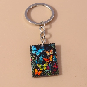 Stamp style butterfly keychain with colorful prints and silver metal ring for accessories