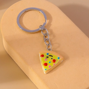 Creative cartoon pizza keychain with resin charm and silver metal ring on display