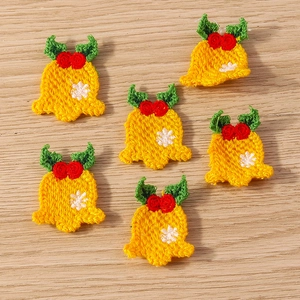 Set of six handmade knitted Christmas yellow bell pendants with rose and leaf detail